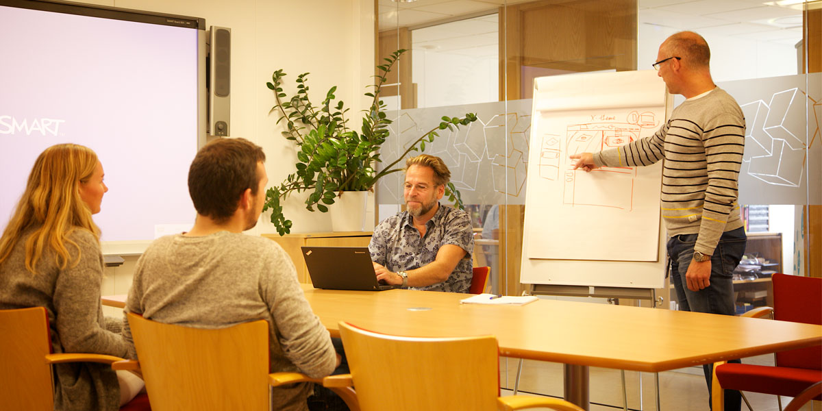 Image of a visually impaired employee using AbleCenter in a meeting room